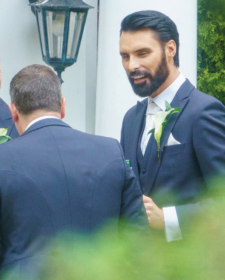 Rylan looked in good spirits as he chatted with wedding guests