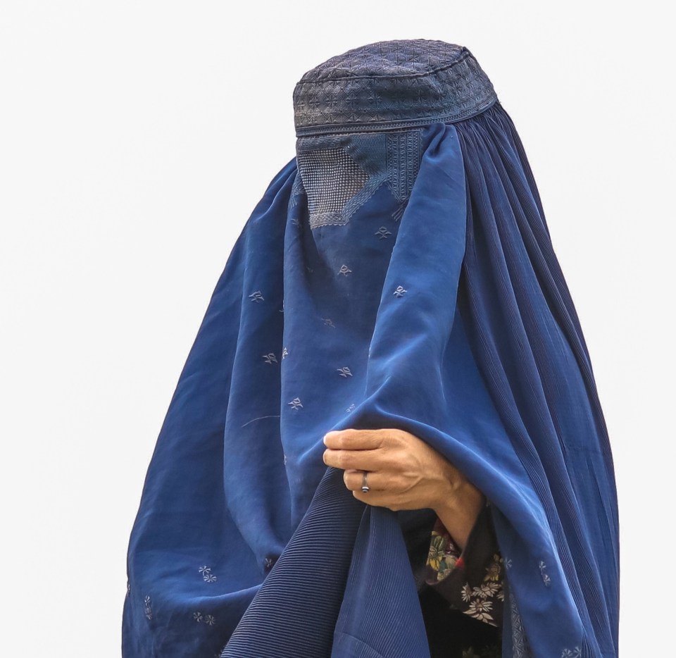 An Afghan woman out in the streets after the fall of Kabul