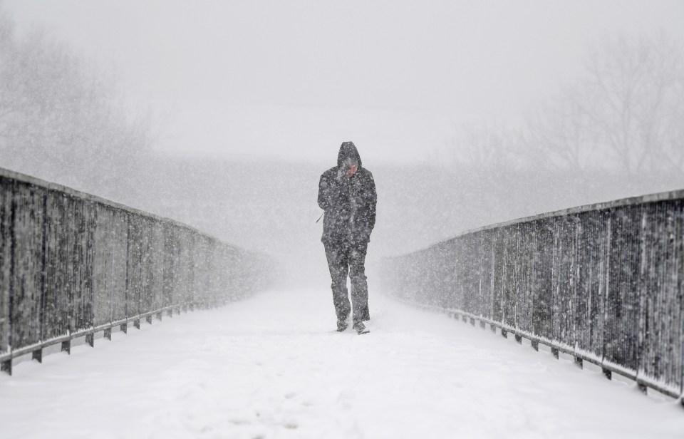 A man trudges through the snow in Glasgow in February this year