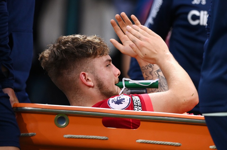 Elliott was able to acknowledge the fans' applause as he was stretchered off