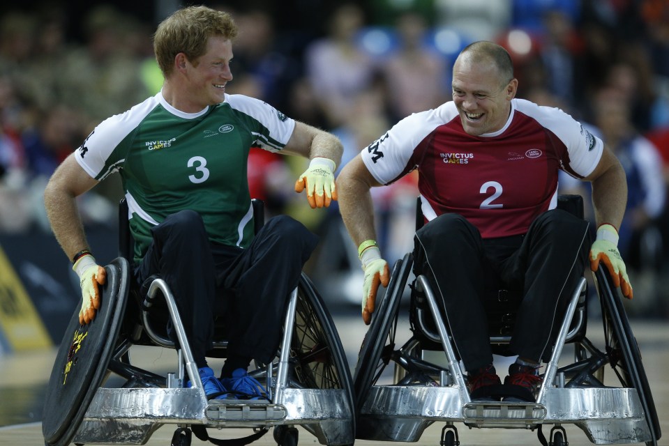 Prince Harry vies with former English rugby player Mike Tindall during a wheelchair rugby match during the Invictus Games in 2014