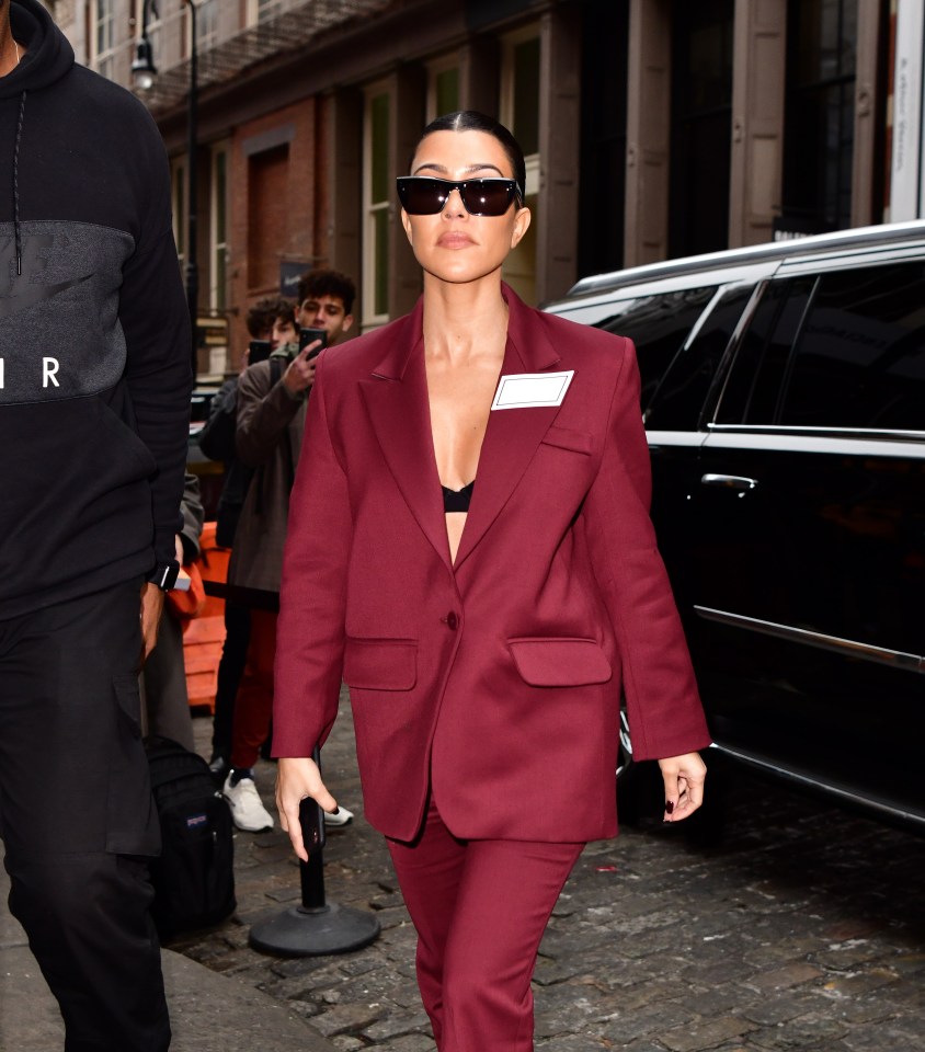 Meghan’s red suit harked back to Kourtney Kardashian’s burgundy ensemble back in 2019