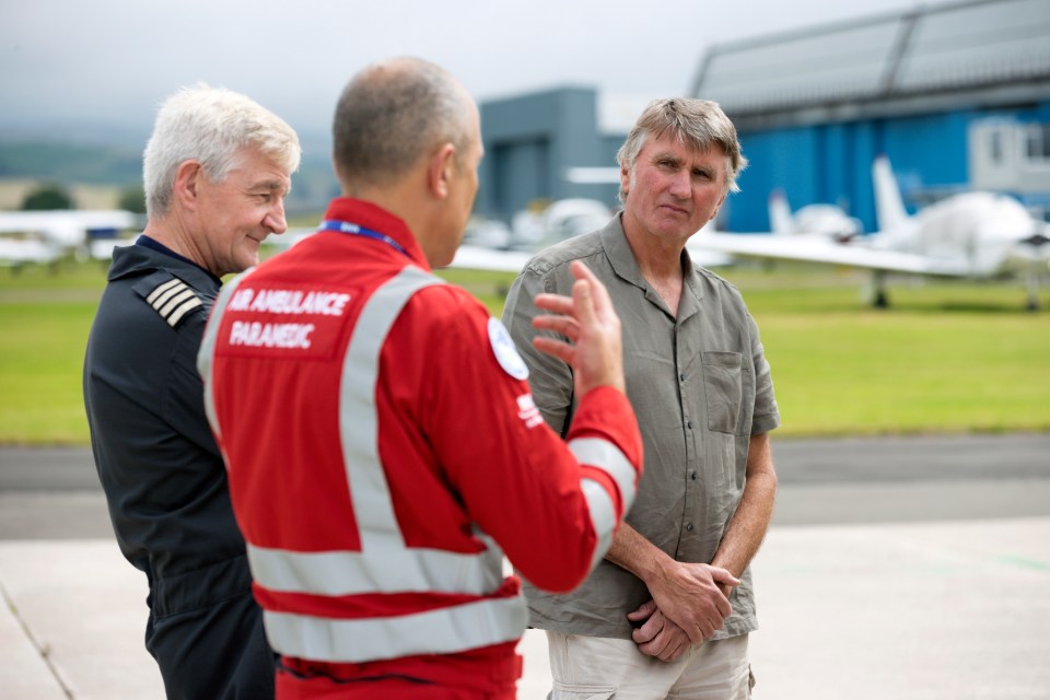 Duncan Stevenson talking with pilot Shaun Rose and paramedic John Pritchard