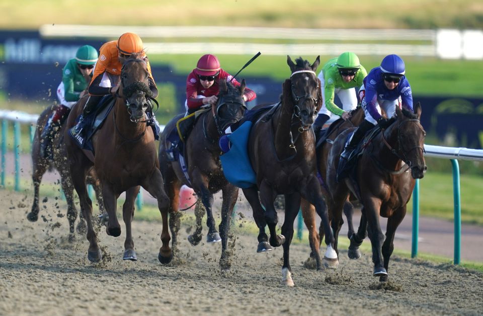 Turner, right, wins another race en route to topping the Racing League jockey standings