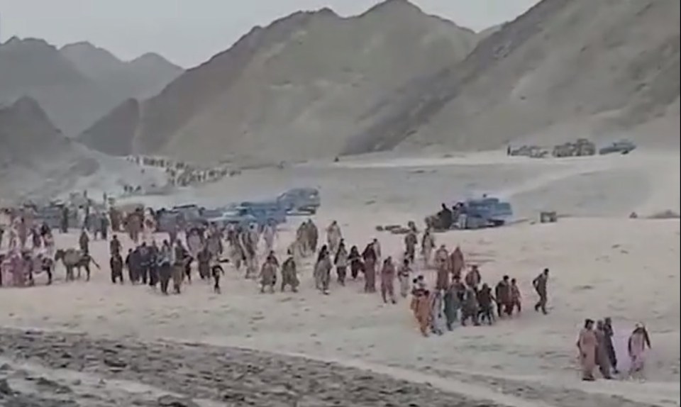 Thousands flee Taliban-held Afghanistan walking miles through the desert across the Pakistani border and into Iran