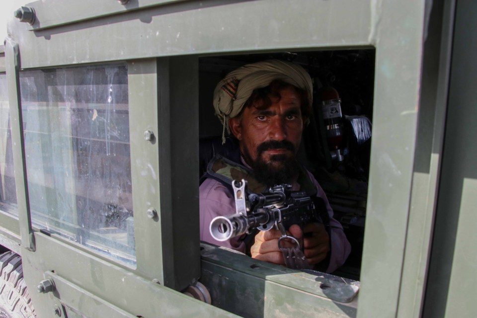 A Taliban fighter lords it after the withdrawal of US forces in Kandahar