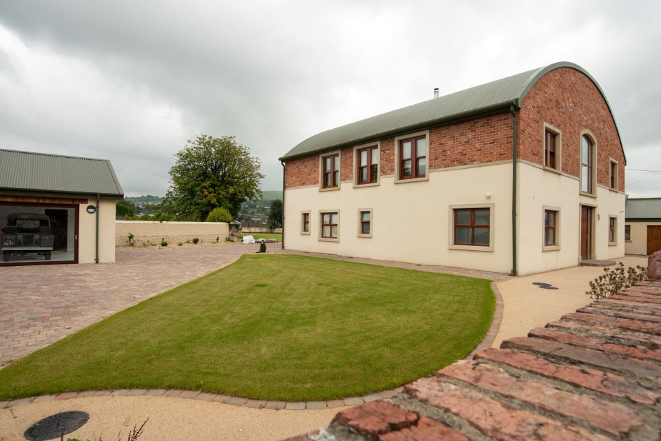 The little house is next door to the showroom and the barrel-roofed converted barn where she planned to live alone.