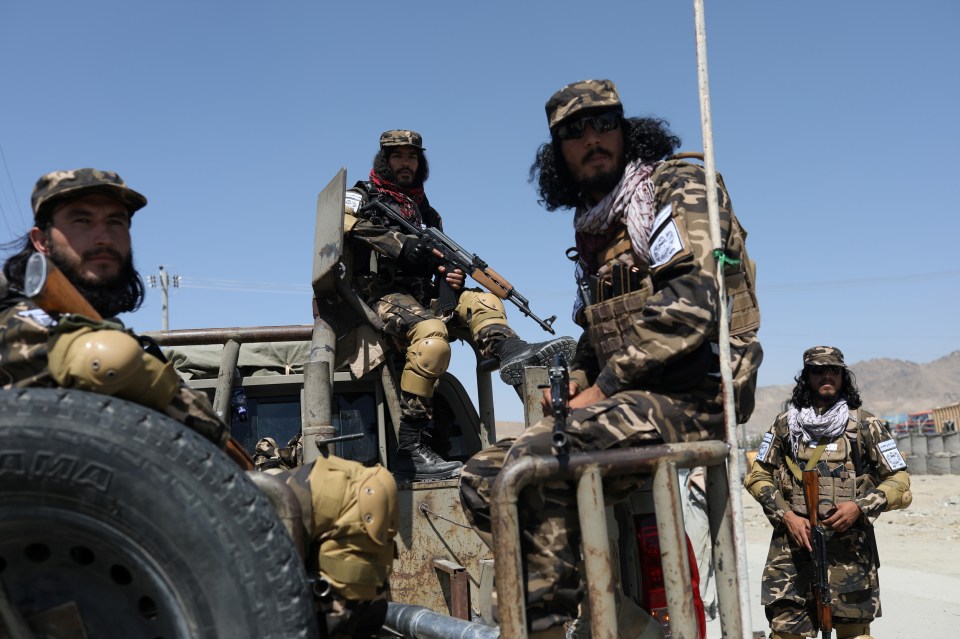 Members of the Taliban Intelligence Special Forces guard the military airfield in Kabul