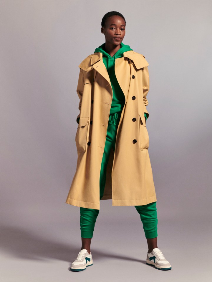 Marks & Spencer recreated some of its greatest hits this autumn, here Beige trench coat, £69, green hoodie, £15, green joggers, £15, and trainers, £35