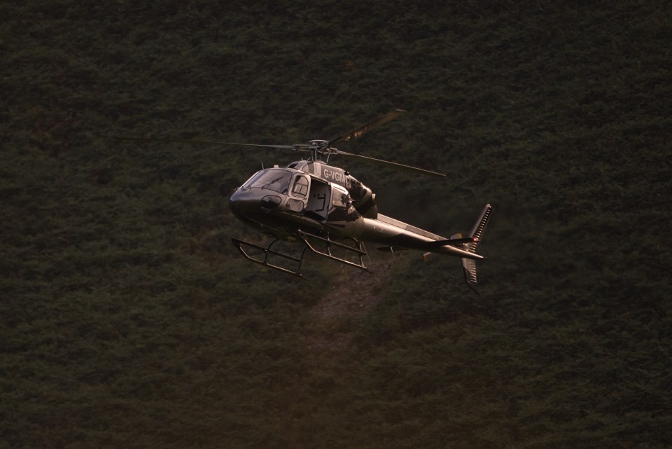 A black helicopter was seen circling the idyllic spot while filming