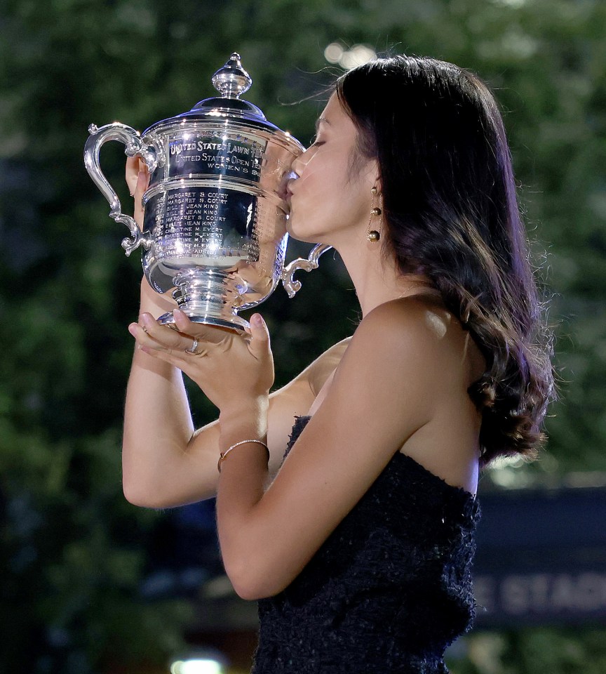 Emma Raducanu kisses the US Open trophy after her historic triumph