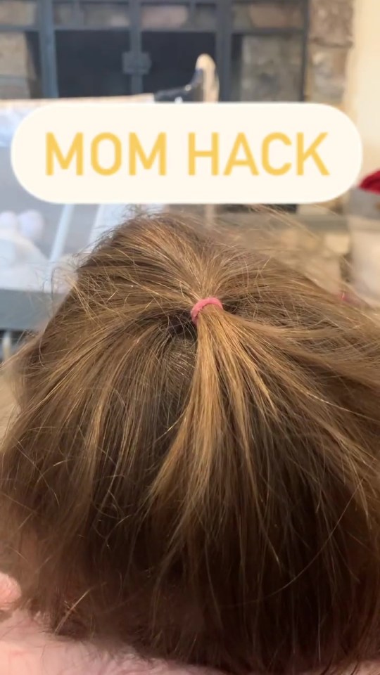 Mum shows how to remove hair tye in pain free mannor