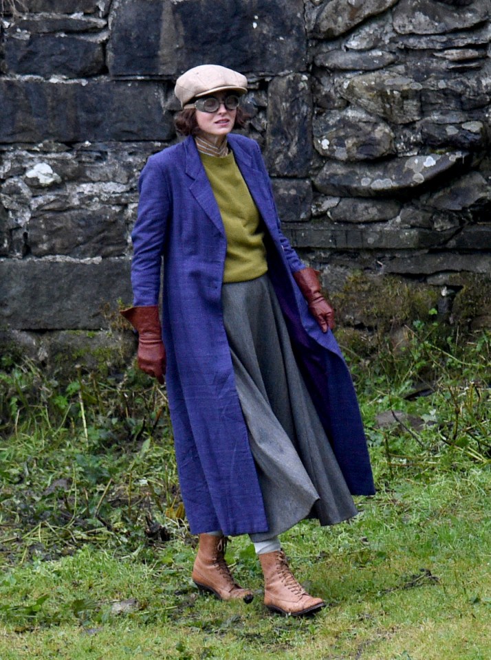 Emma Corrin dressed in a long blue coat for her role in Lady Chatterley's Lover