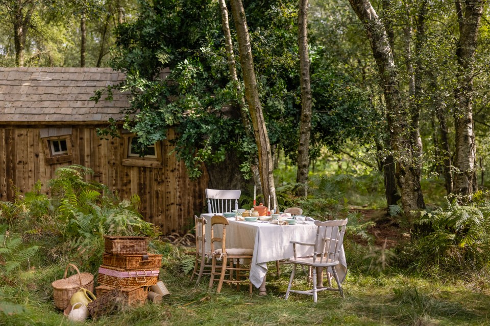 There is even an outdoor dining area nestled into the woods