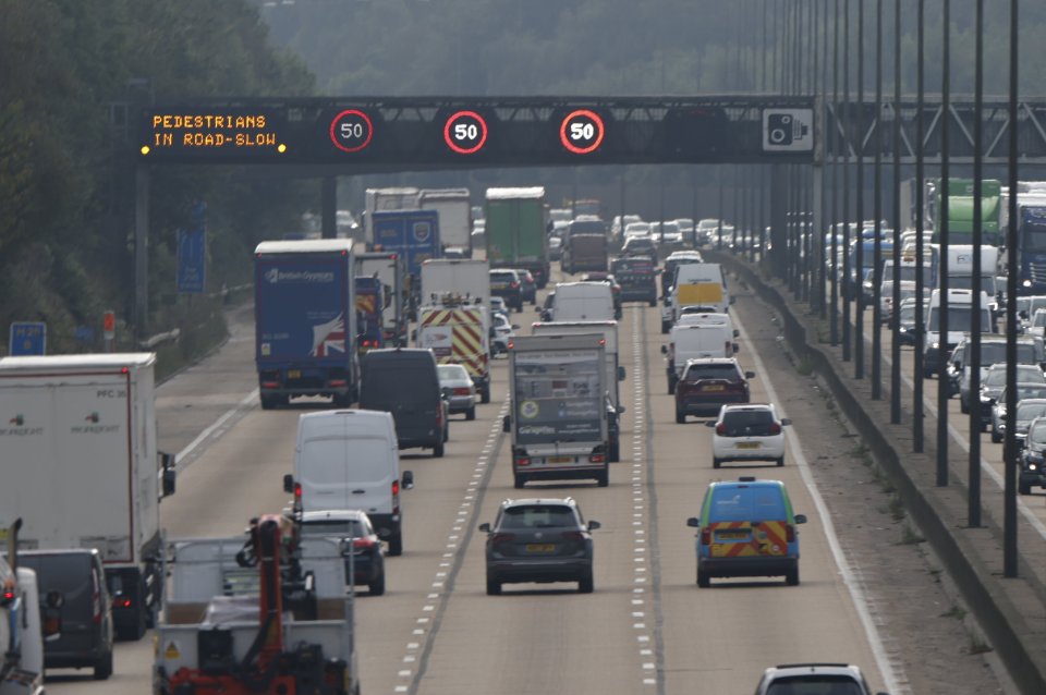 Slow traffic as signs warn of pedestrians on the motorway