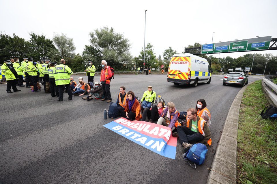 Hi-vis wearing demonstrators plonked themselves in the road