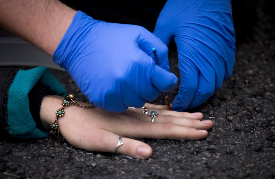 One woman glued her hand to the road in the Dartford Crossing area