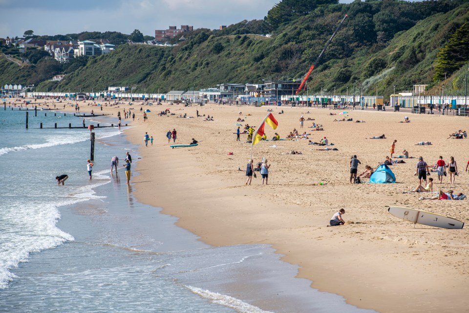 Bournemouth beach packed out with day trippers enjoy the rays