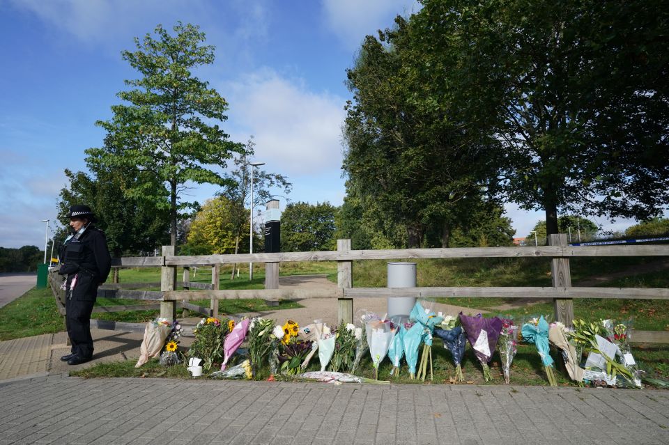 Dozens of mourners have left tributes for the tragic teacher