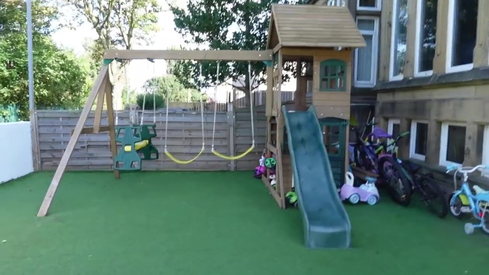 The front yard has a play area for the children