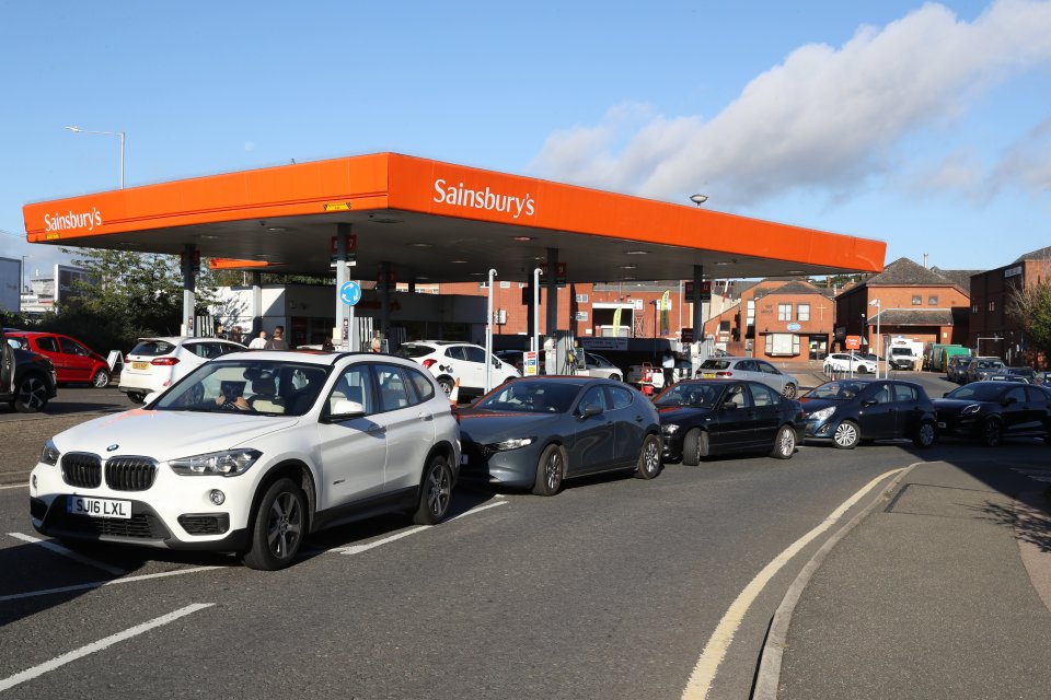 Drivers queue at a Sainsbury's petrol station amid fears of a fuel shortage