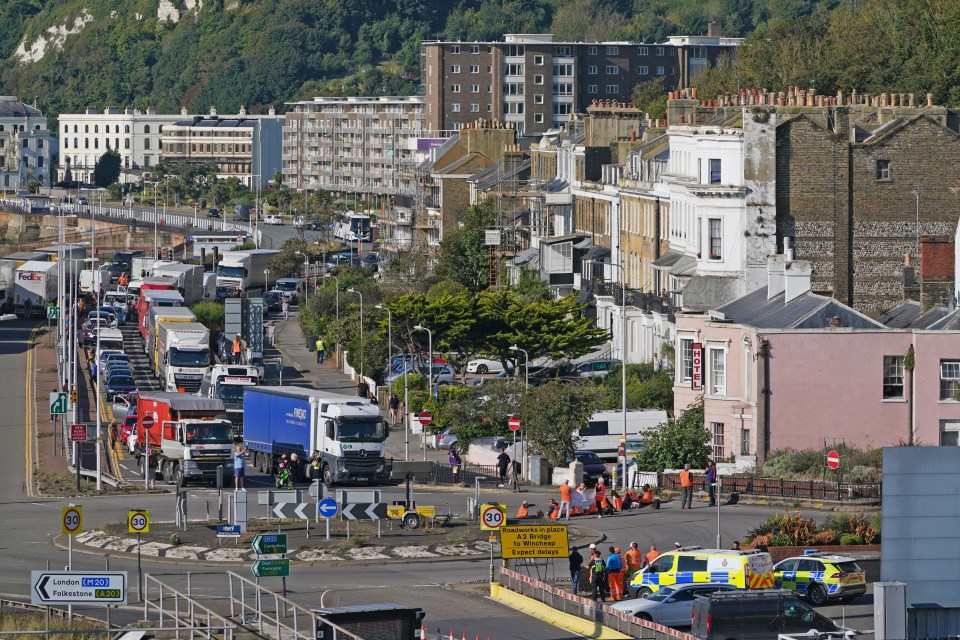 Protesters from Insulate Britain block the A20 in Kent, which provides access to the Port of Dover