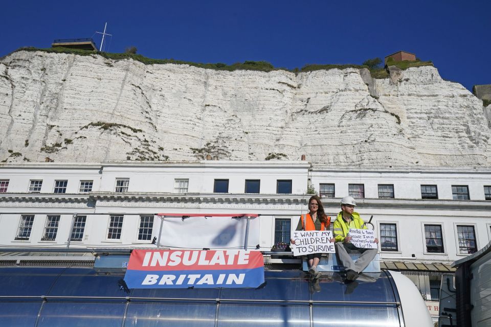 One woman holds a placard which reads: 'I want my children to survive'