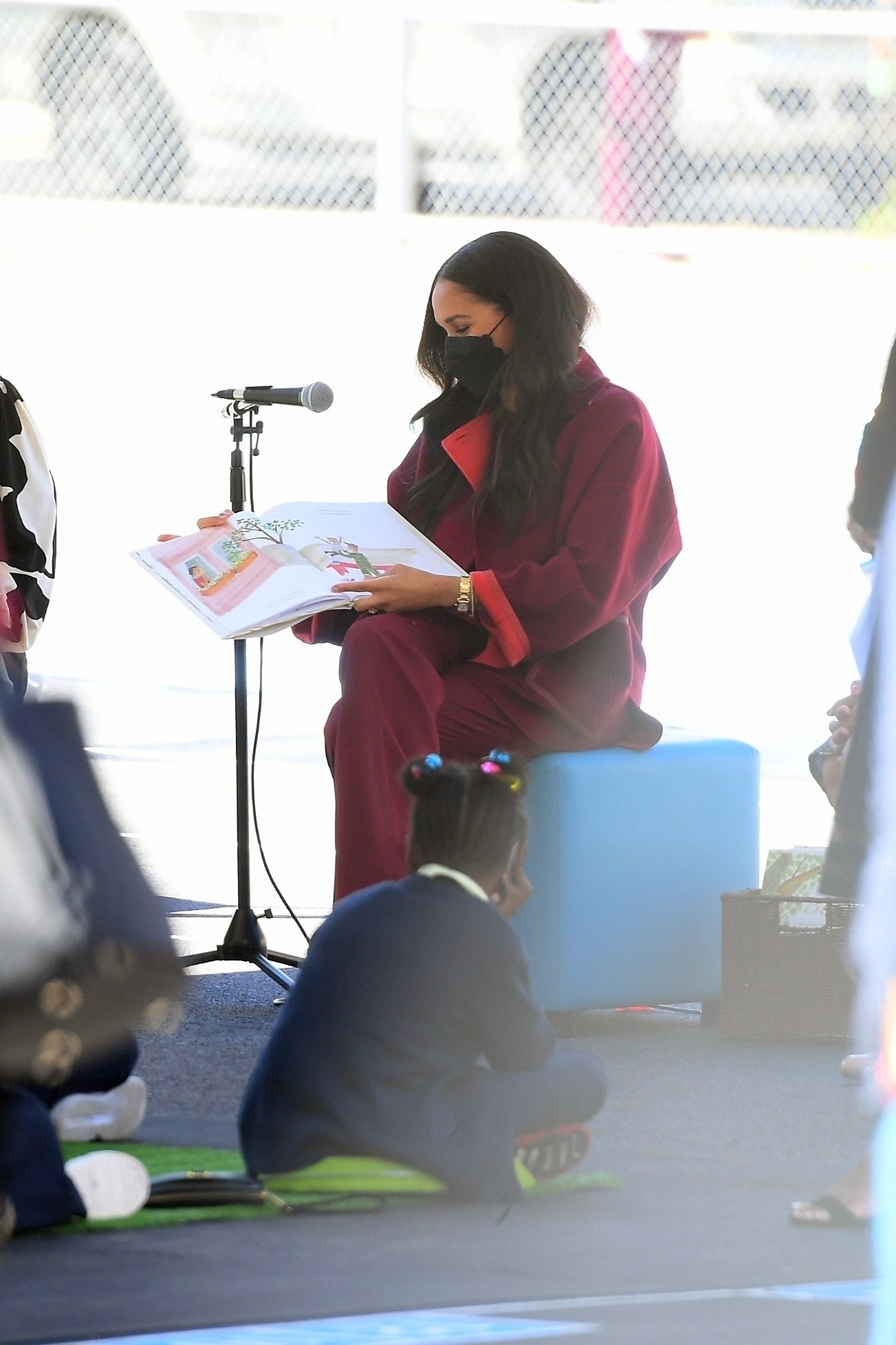 Schoolkids watched on as Meghan read her book at a Harlem school