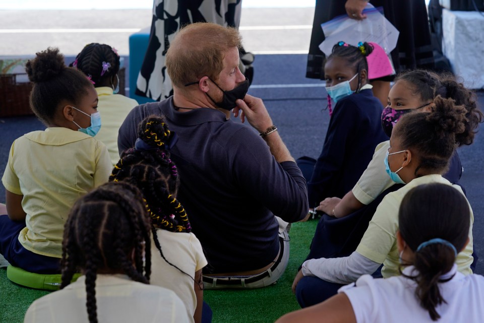 The Prince chats to the kids around him