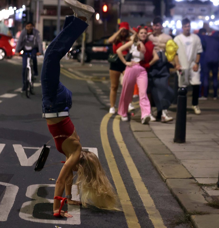 One woman pulls off an impressive hand stand