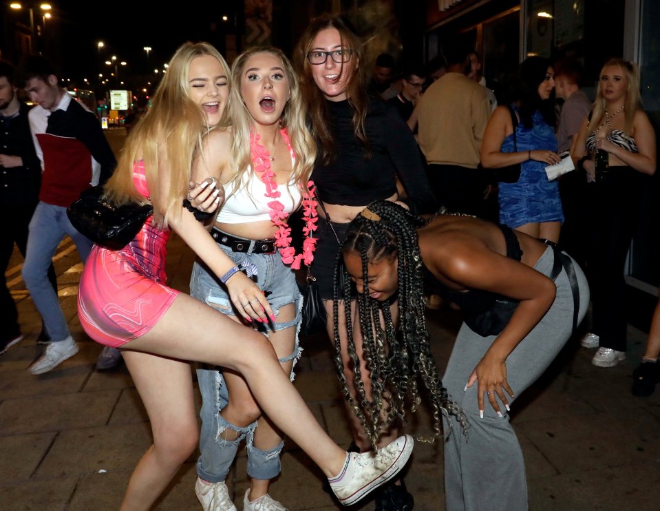 Pals share a laugh as they pose for a photo