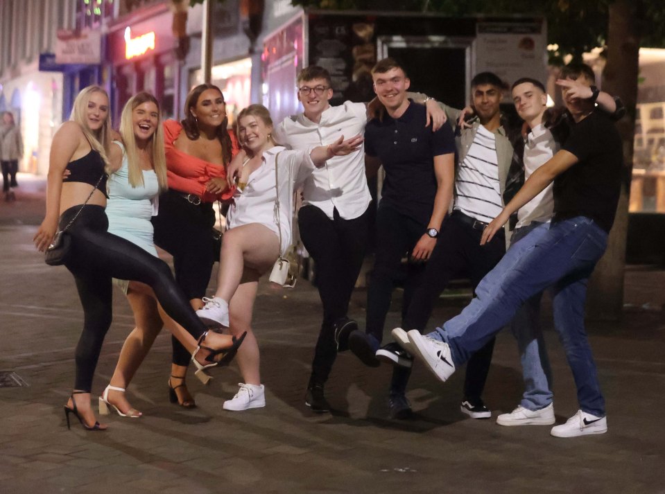 Friends grin and point as they hit the town