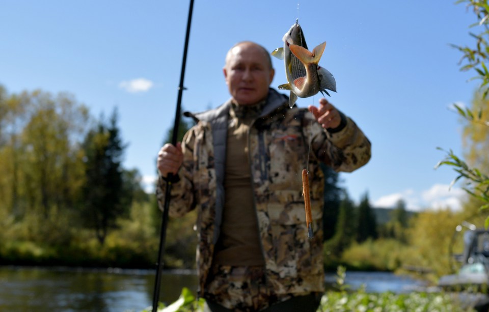 Russian President Vladimir Putin fishes during a short vacation at an unknown location in Siberia