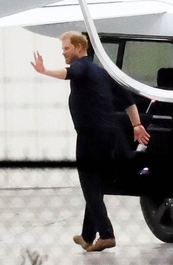 Harry gave members of his crew a wave before departing