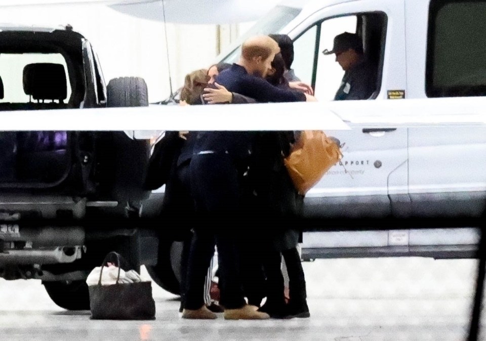 The Duke embraced members of the team after touching down in California