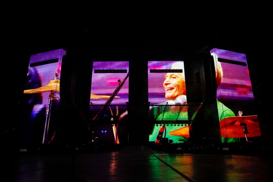 Images of late Rolling Stone Charlie Watts dominate the video screens as the band resume their No Filter tour