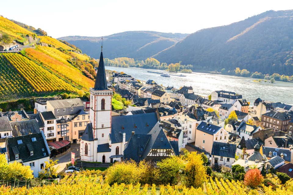 The sun glows over quaint villages and rolling countryside as the ship glides through the water