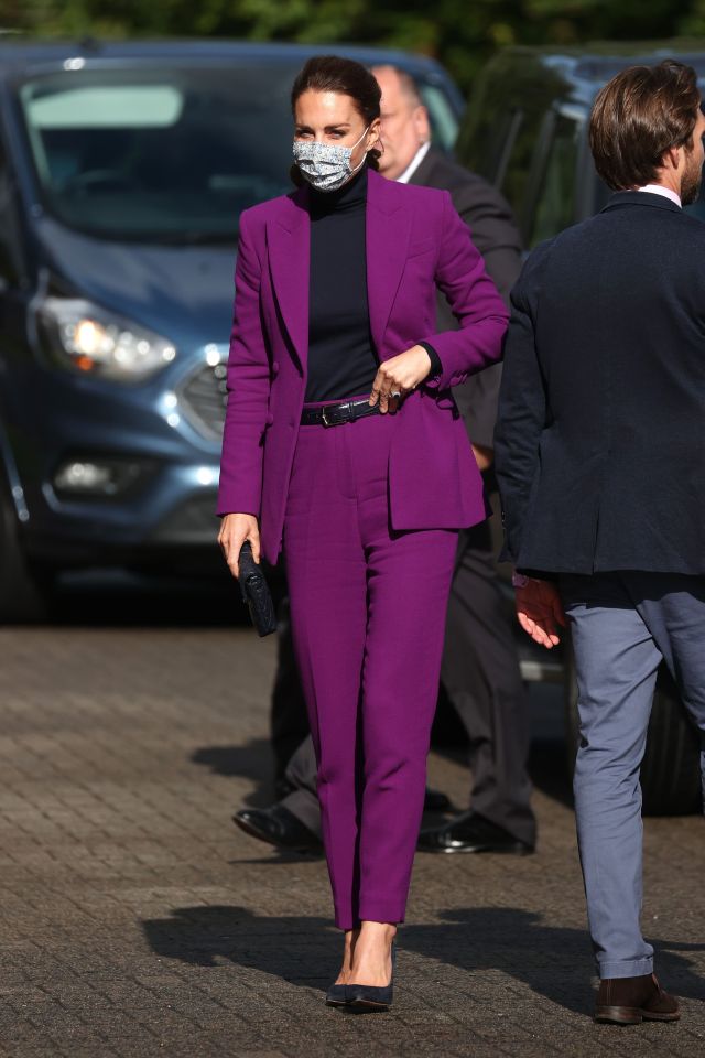 Today Kate stunned in a slim fit purple suit and simple pump heels