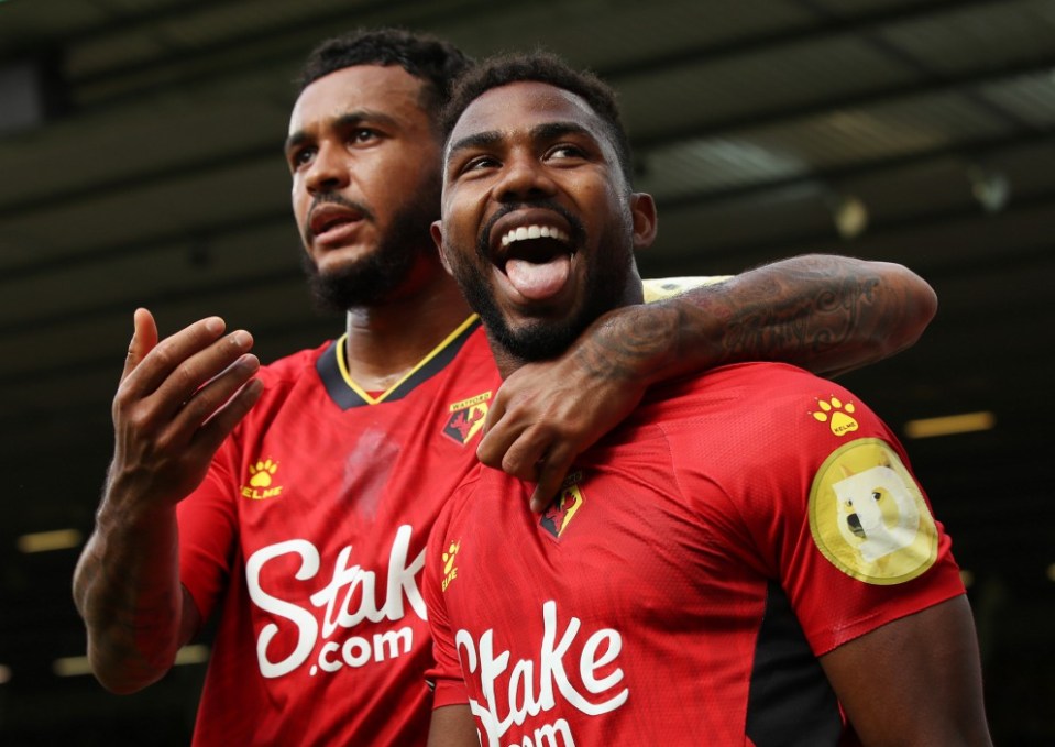 Emmanuel Dennis (right) celebrates his second goal of the season