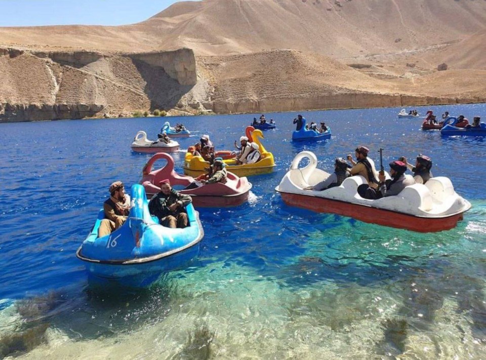 Swanning around - the militants take time out of their busy schedule to relax on the childish pedalos, Bamiyan province