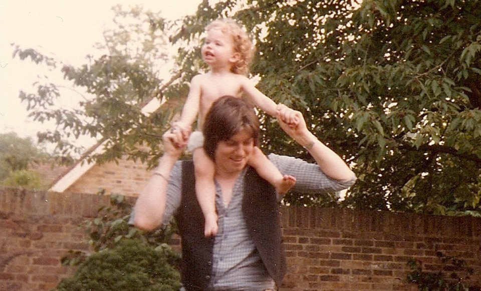 Sarah as a baby with her father John