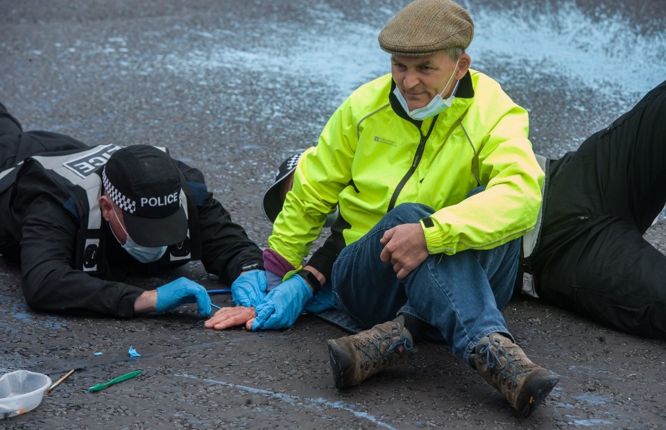 Boris Johnson said: 'I don’t think these people do any favours to their cause' - pictured a protester glued to the ground at Hatfield