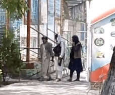 Taliban fighters patrol the animal park