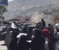 Taliban trucks roll in to break up the protest in Kabul