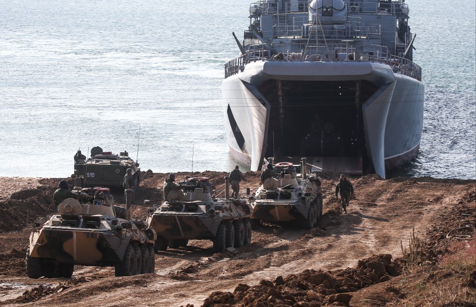 Several tanks land on the beach during the war games