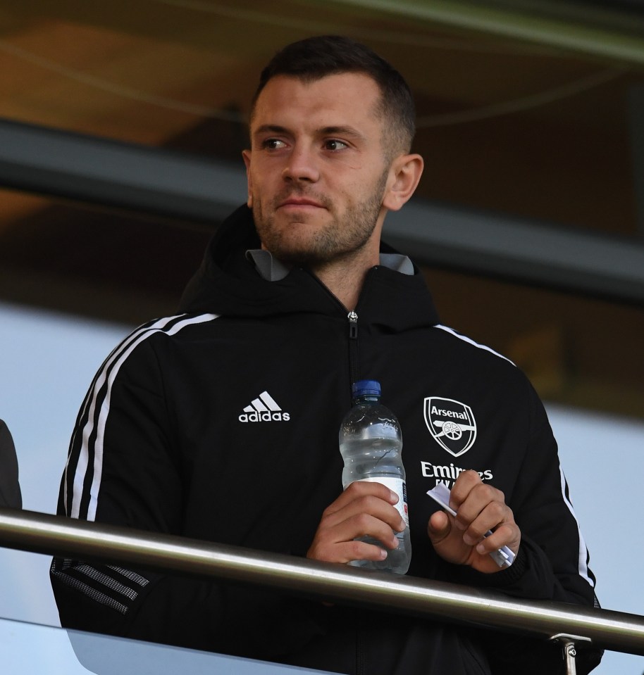 Wilshere smiled as he watched Arsenal's Under-21s against Newport County