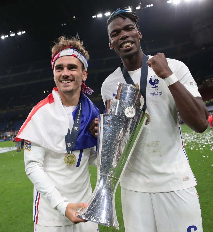 Pogba and Griezmann holding the Nations League trophy