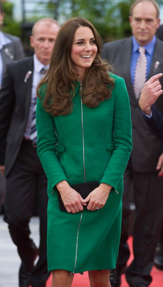 Catherine, Duchess of Cambridge, in a green coat, at an official visit.