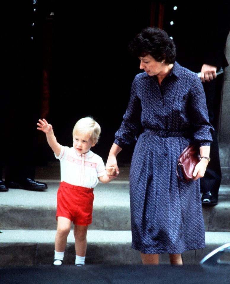 Prince William waves to the crowd as he leaves the Lindo Wing of St. Mary's Hospital, London, with his nanny Barbara Barnes after Harry was born