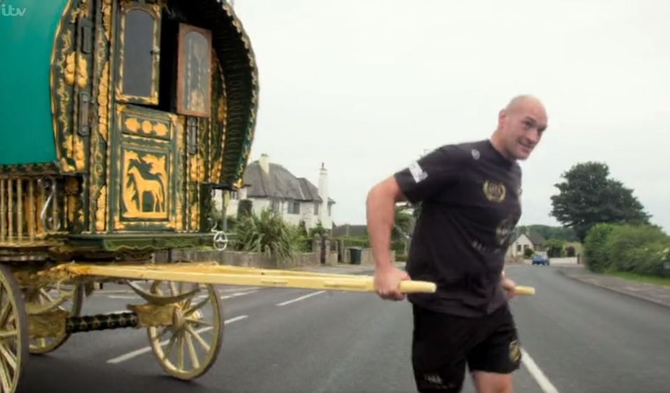 Tyson was seen wheeling around an ornately designed wagon outside his Morecambe home